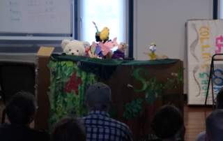 Puppet show performance by middle school students during Lott Music Studio summer camp.