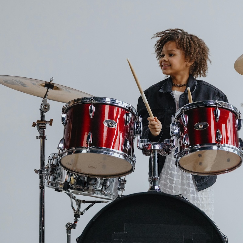 Student playing drums during Rock Camp at Lott Music Studio in Ames, Iowa.