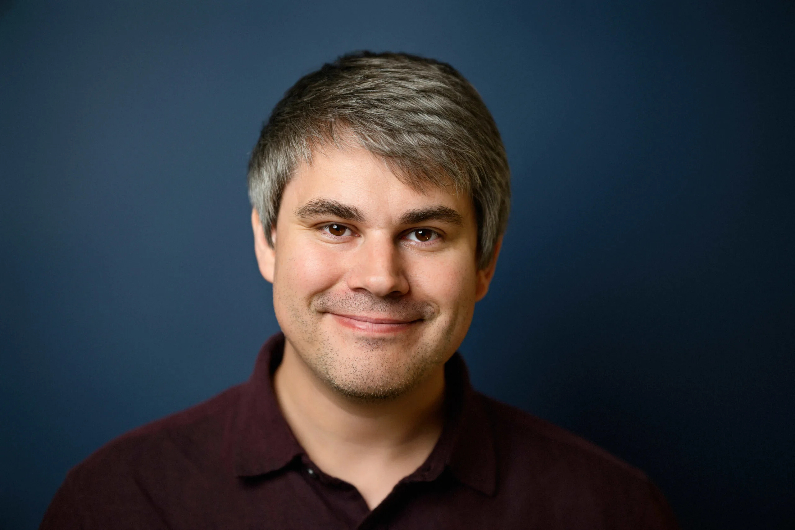 Professional headshot of Alex Aldridge, classical and acoustic guitar instructor at Lott Music Studio.