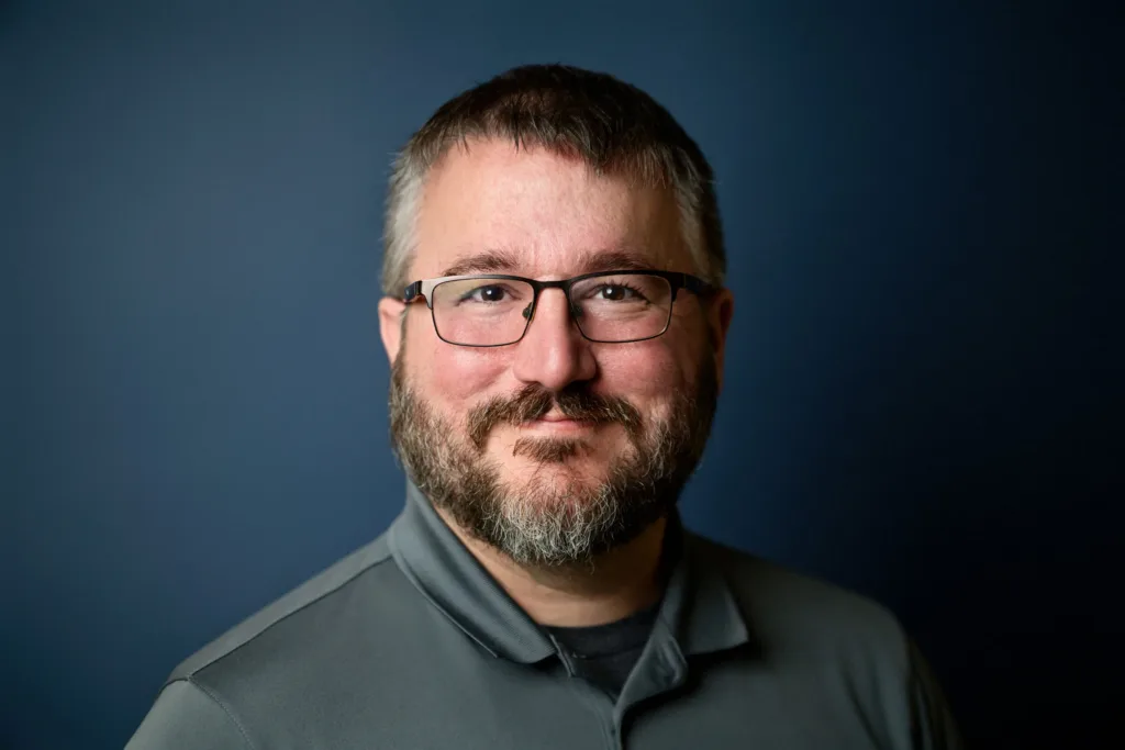 Professional headshot of Brandon Williams, guitar, bass, and ukulele instructor at Lott Music Studio.