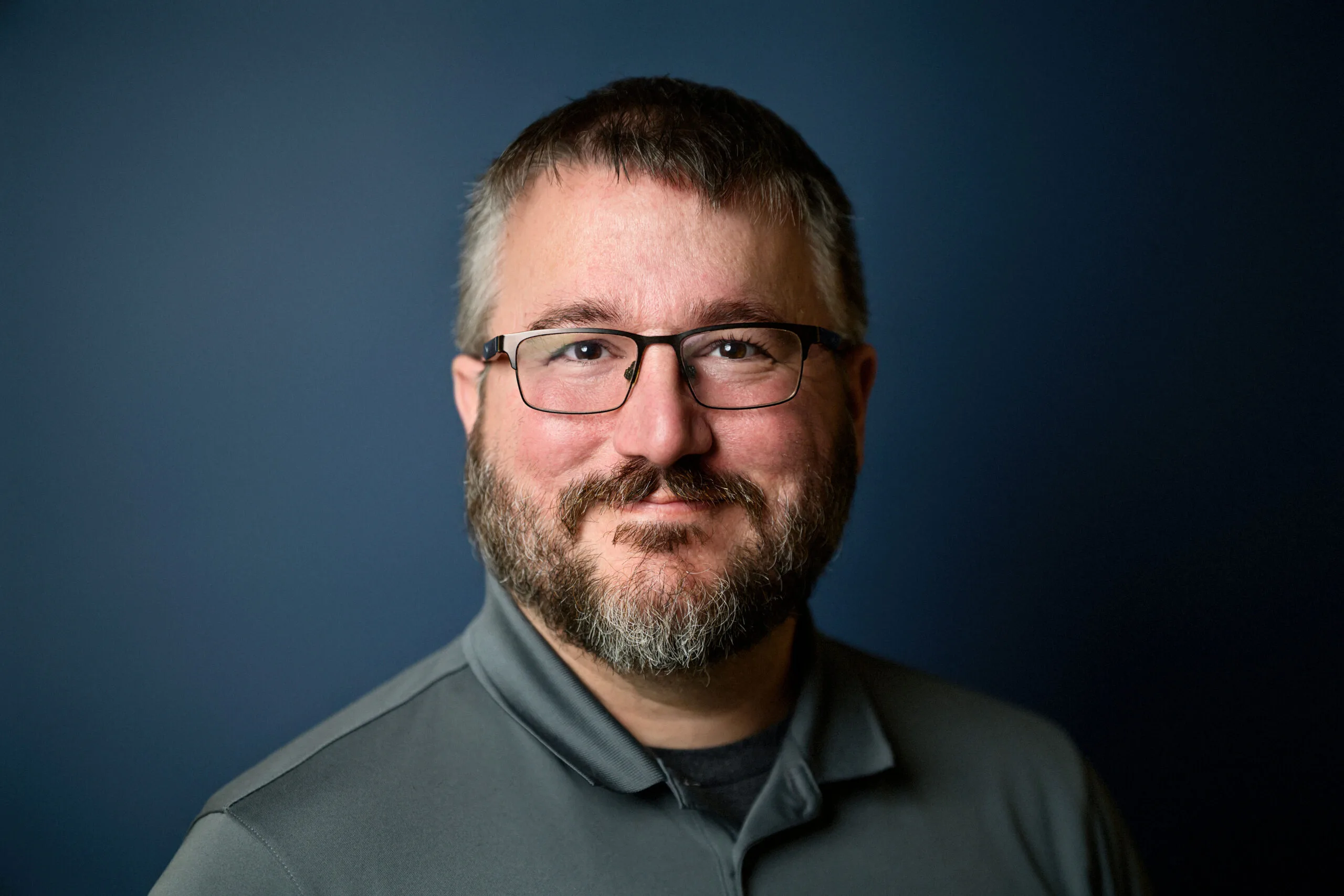 Professional headshot of Brandon Williams, guitar, bass, and ukulele instructor at Lott Music Studio.