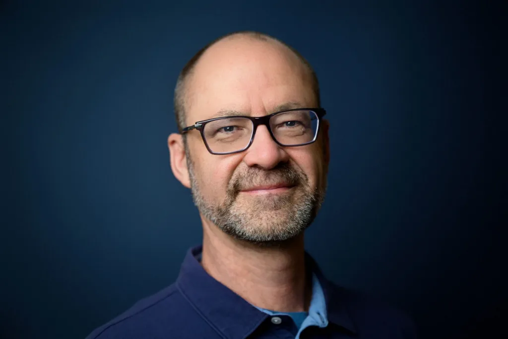 Professional headshot of Christian Daley, electric and acoustic guitar instructor at Lott Music Studio.